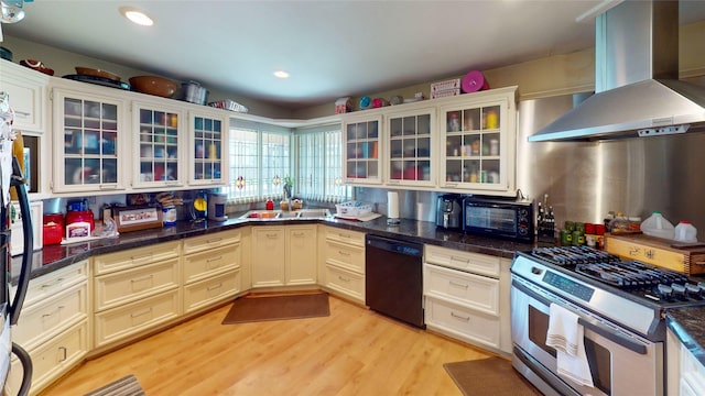 19115 Shay Ln, Humble, TX 77346 - kitchen featuring black appliances, ventilation hood, light wood-style flooring, recessed lighting, and a sink
