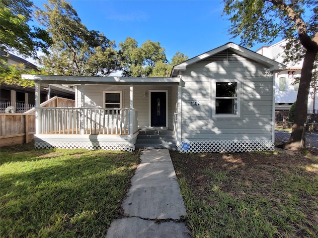 4302 Dickson St, Houston, TX 77007 - bungalow-style home featuring a porch