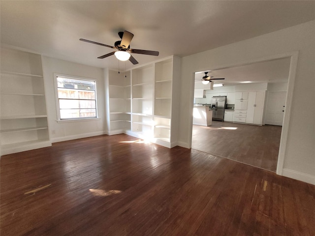 4302 Dickson St, Houston, TX 77007 - unfurnished room with built in shelves, ceiling fan, baseboards, and dark wood-style floors