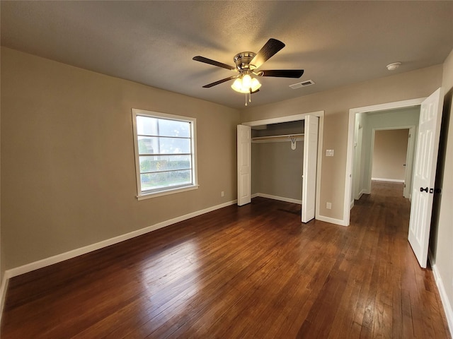 4302 Dickson St, Houston, TX 77007 - unfurnished bedroom with dark wood-style flooring, a closet, baseboards, and ceiling fan