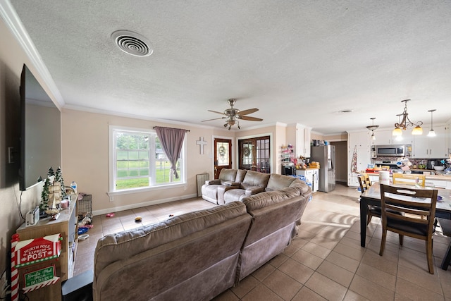23114 Laura, New Caney, TX 77357 - living room with ornamental molding, light tile patterned floors, a textured ceiling, baseboards, and ceiling fan