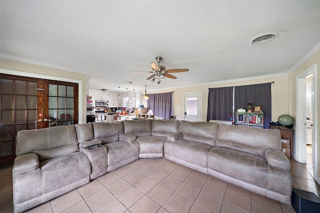 23114 Laura, New Caney, TX 77357 - living area with a ceiling fan, light tile patterned flooring, and crown molding