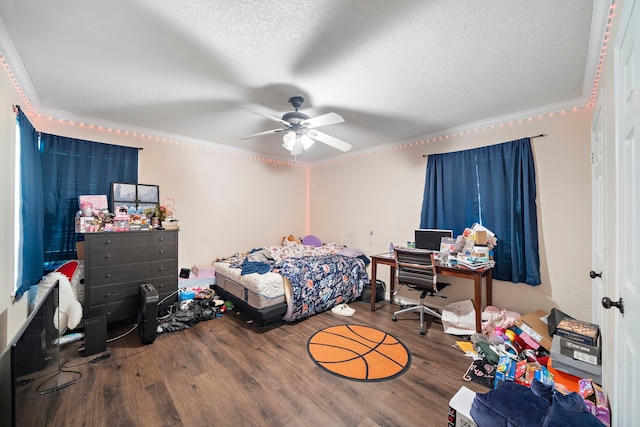 23114 Laura, New Caney, TX 77357 - bedroom featuring ornamental molding, wood finished floors, a textured ceiling, and ceiling fan