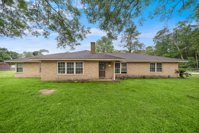 23114 Laura, New Caney, TX 77357 - view of front facade with a chimney and brick siding