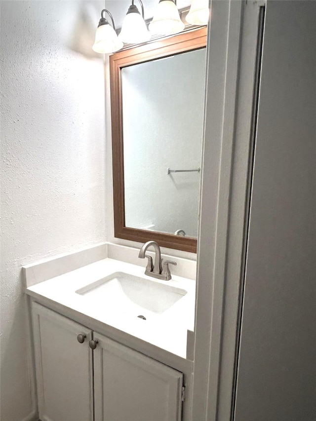 8702 Victorian Village Dr Unit 8702, Houston, TX 77071 - bathroom with vanity and a textured wall