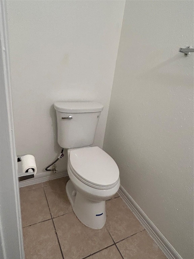 8702 Victorian Village Dr Unit 8702, Houston, TX 77071 - bathroom with tile patterned flooring, toilet, and baseboards