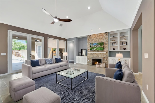living room with a ceiling fan, built in shelves, baseboards, a fireplace, and vaulted ceiling