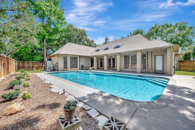 view of pool featuring a fenced backyard and a patio
