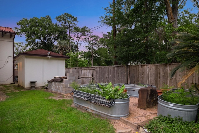 view of yard with an outdoor structure and a storage unit