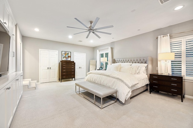 bedroom with light colored carpet, a ceiling fan, recessed lighting, and baseboards