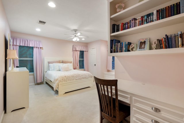 bedroom featuring light carpet, recessed lighting, a desk, and a ceiling fan
