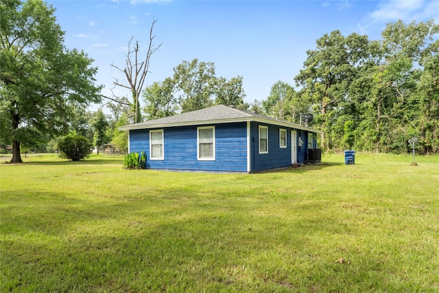 139 Holly Rdg, Onalaska, TX 77360 - view of property exterior featuring a lawn and central AC