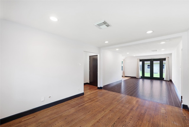 5418 Poinciana Dr, Houston, TX 77092 - spare room with wood finished floors, baseboards, and recessed lighting