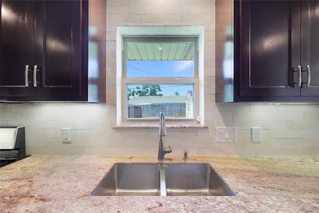 5418 Poinciana Dr, Houston, TX 77092 - kitchen with a sink, backsplash, and light stone counters