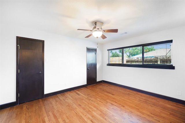 5418 Poinciana Dr, Houston, TX 77092 - empty room featuring baseboards, ceiling fan, and wood finished floors