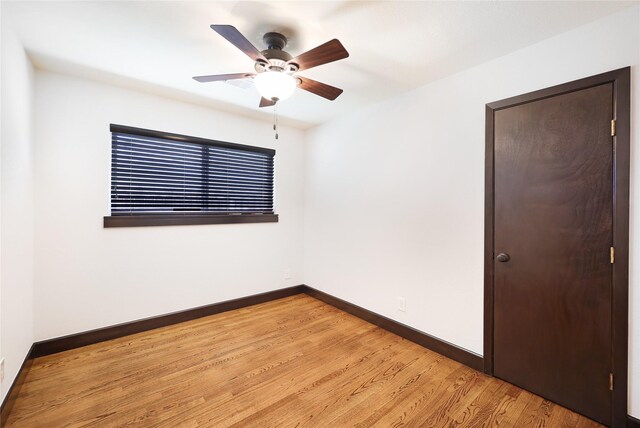 5418 Poinciana Dr, Houston, TX 77092 - unfurnished room featuring baseboards, light wood-style flooring, and a ceiling fan