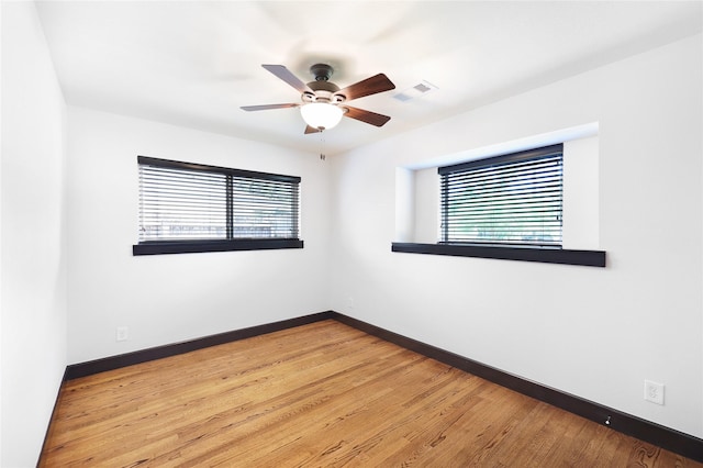 5418 Poinciana Dr, Houston, TX 77092 - spare room with a ceiling fan, light wood-type flooring, and baseboards