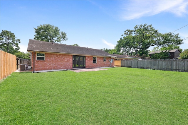 5418 Poinciana Dr, Houston, TX 77092 - rear view of property with brick siding, central AC, and a patio