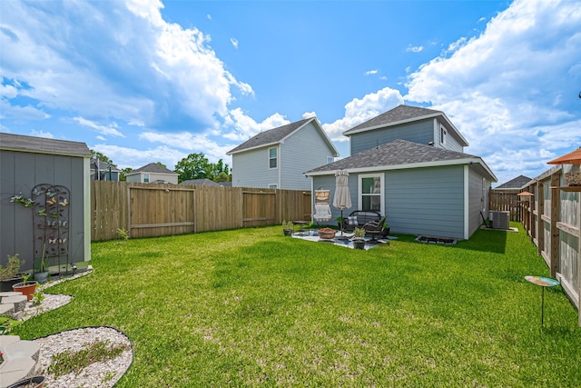 view of yard with cooling unit, an outdoor structure, a shed, and a patio