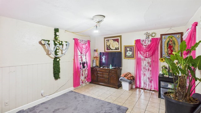 8935 Duane St, Houston, TX 77051 - sitting room featuring light tile patterned floors, wainscoting, and wooden walls