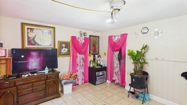 8935 Duane St, Houston, TX 77051 - living area with light tile patterned floors and wainscoting