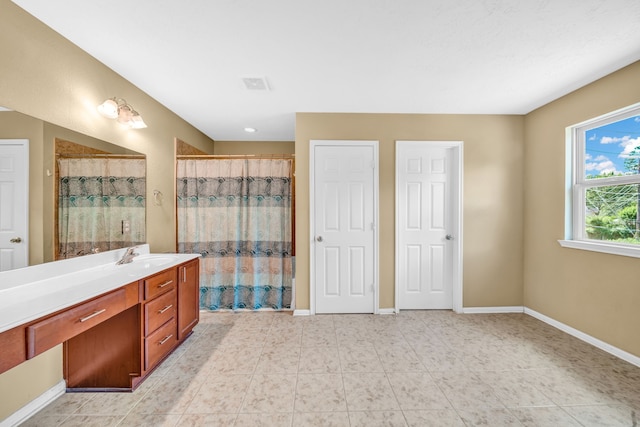 20703 Fawn Timber Trl, Humble, TX 77346 - bathroom featuring baseboards, vanity, and curtained shower