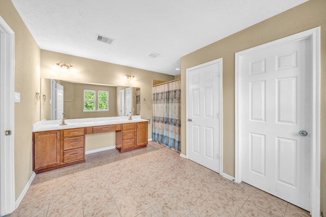 20703 Fawn Timber Trl, Humble, TX 77346 - full bathroom with double vanity, baseboards, a shower with curtain, and tile patterned flooring
