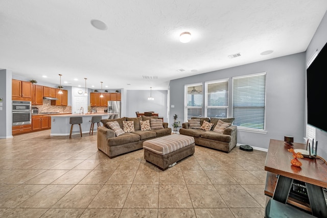 20703 Fawn Timber Trl, Humble, TX 77346 - living area with light tile patterned floors, recessed lighting, baseboards, and a textured ceiling