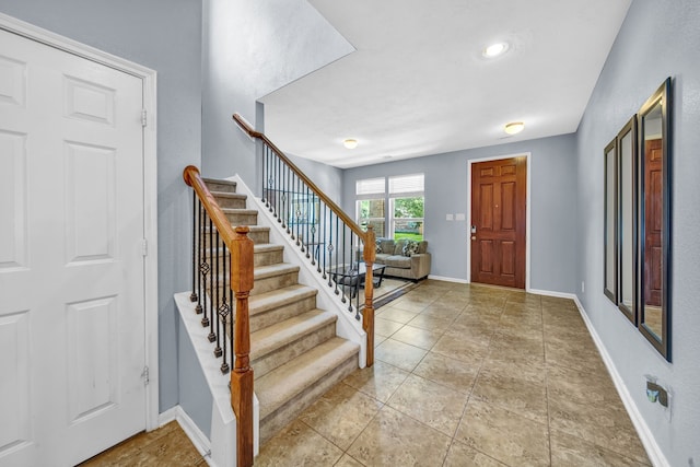 20703 Fawn Timber Trl, Humble, TX 77346 - entrance foyer featuring stairway and baseboards
