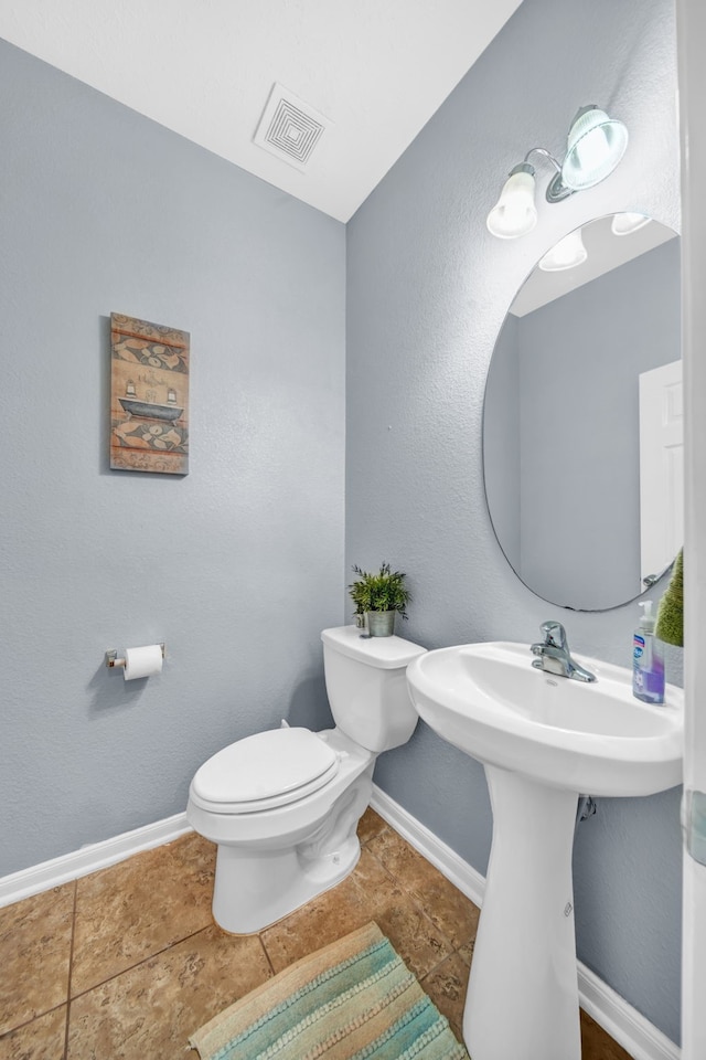 20703 Fawn Timber Trl, Humble, TX 77346 - half bath featuring toilet, baseboards, and a sink