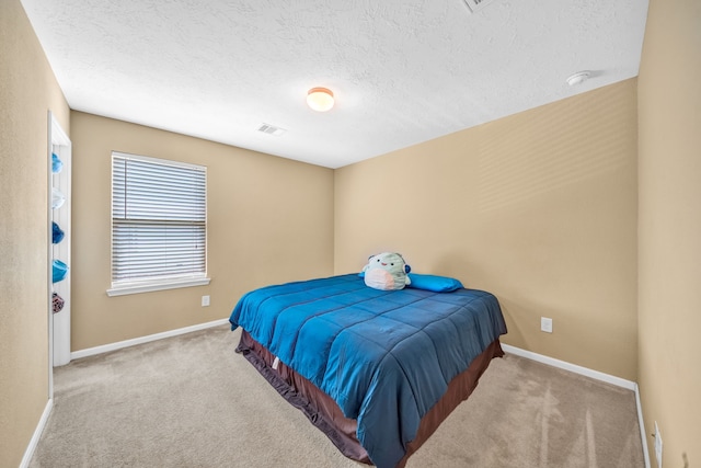 20703 Fawn Timber Trl, Humble, TX 77346 - carpeted bedroom featuring a textured ceiling and baseboards