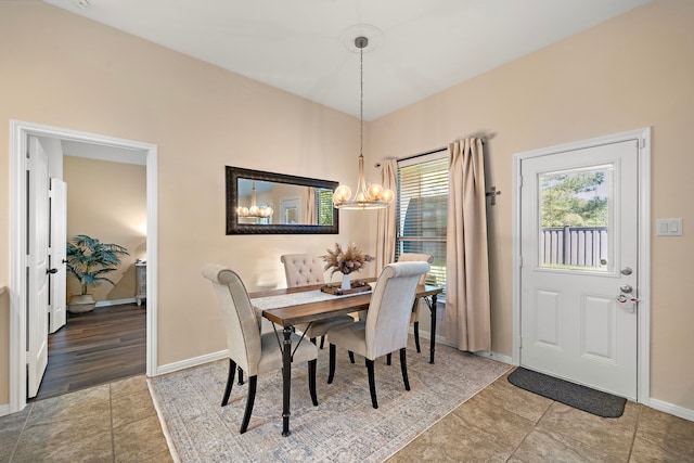 3418 Daniel Falls Ln, Katy, TX 77449 - tiled dining room with a chandelier and baseboards