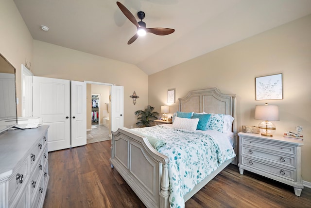 3418 Daniel Falls Ln, Katy, TX 77449 - bedroom with lofted ceiling, dark wood finished floors, a ceiling fan, and ensuite bath