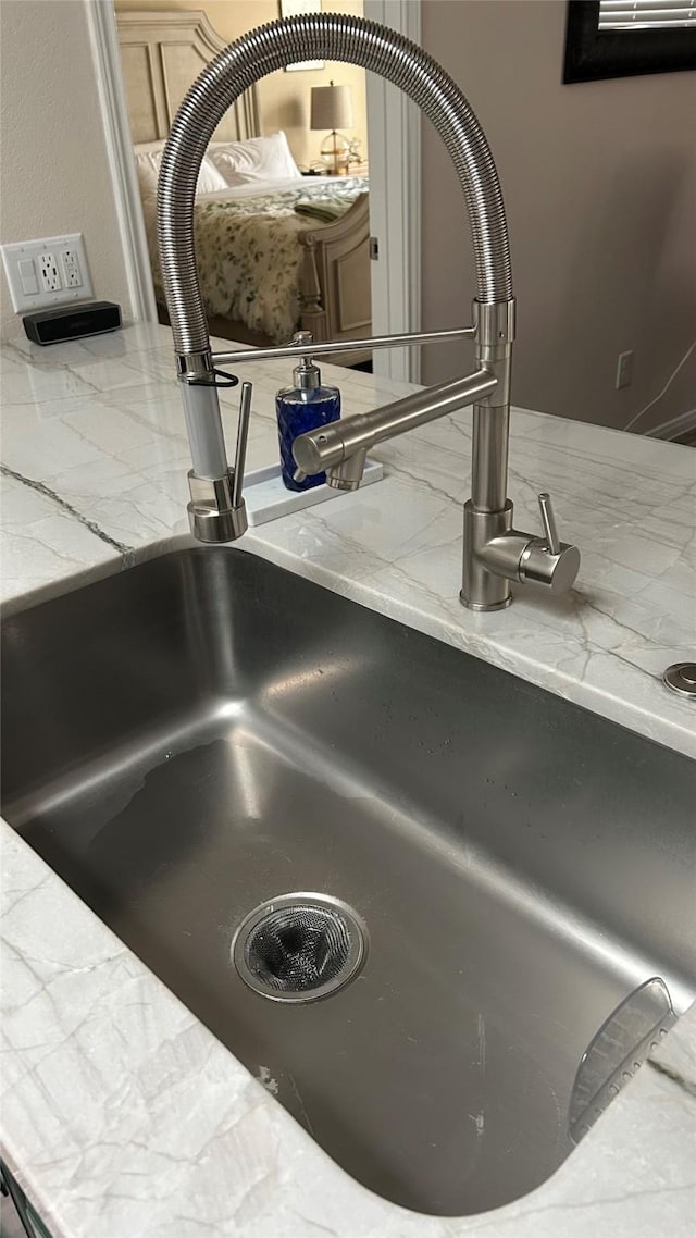 3418 Daniel Falls Ln, Katy, TX 77449 - kitchen view of a sink and light stone countertops
