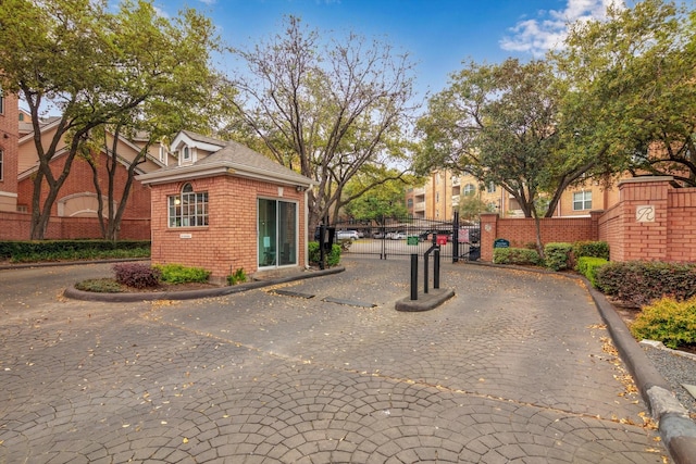 2111 Welch St Unit B201, Houston, TX 77019 - view of side of home featuring a gate, brick siding, and fence