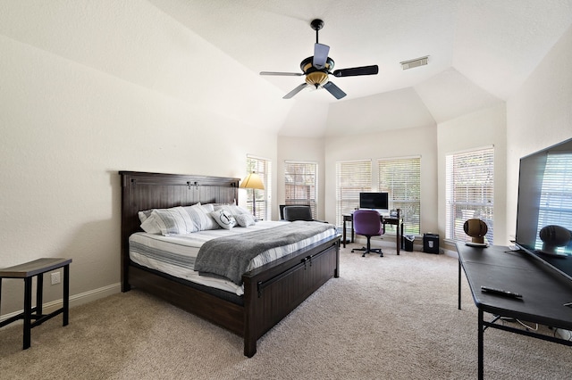 bedroom with light carpet, an office area, baseboards, a ceiling fan, and high vaulted ceiling