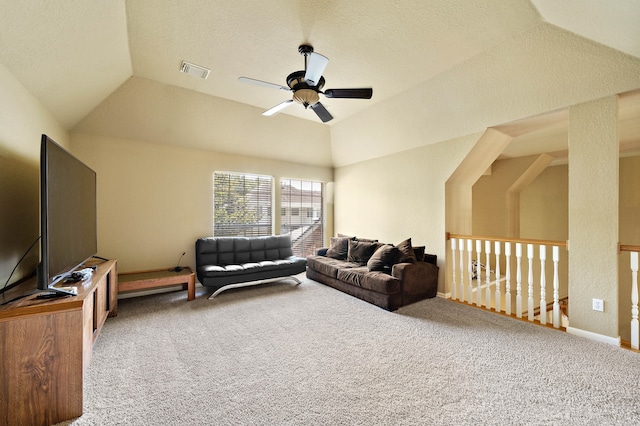 carpeted living area featuring lofted ceiling and a ceiling fan