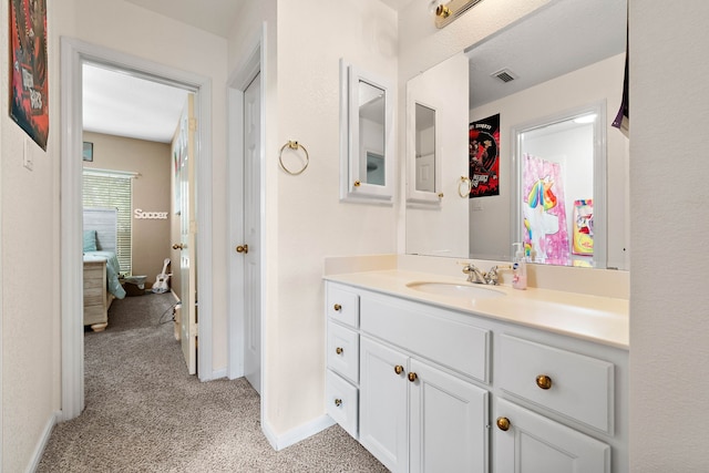 bathroom featuring vanity and baseboards