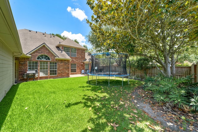 view of yard featuring a trampoline