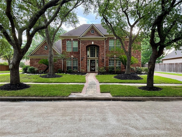 view of front of house featuring brick siding