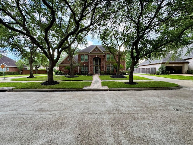 view of front of house featuring brick siding