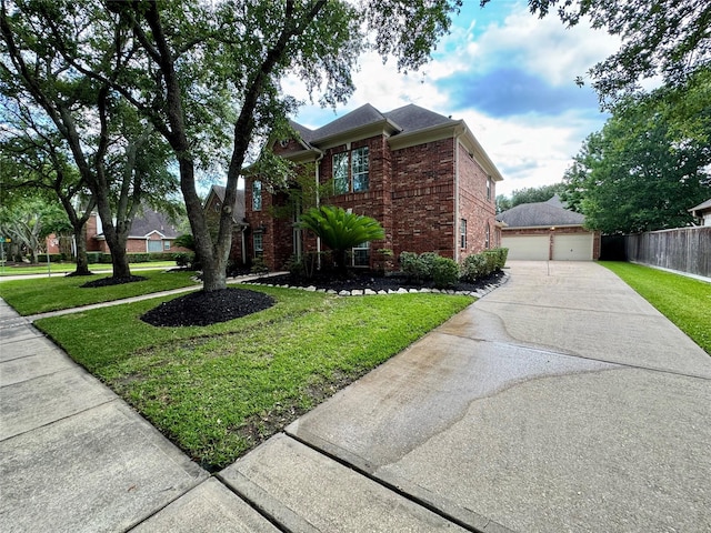 view of front of property featuring brick siding and a detached garage