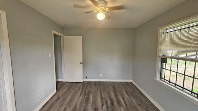 4215 Los Angeles St, Houston, TX 77026 - spare room with a ceiling fan, wood finished floors, and baseboards
