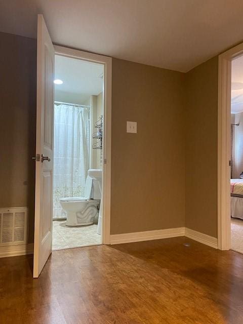 52 April Hl Unit 52, Conroe, TX 77356 - empty room featuring wood finished floors and baseboards