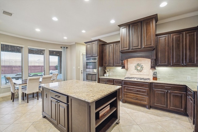 2011 Greenvine Cir, Katy, TX 77494 - kitchen featuring appliances with stainless steel finishes, light tile patterned floors, backsplash, recessed lighting, and crown molding