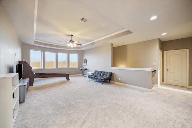 2011 Greenvine Cir, Katy, TX 77494 - living area featuring a raised ceiling, light carpet, baseboards, ceiling fan, and recessed lighting
