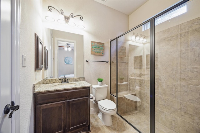 2011 Greenvine Cir, Katy, TX 77494 - bathroom with a stall shower, toilet, a textured wall, vanity, and tile patterned flooring