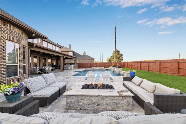 2011 Greenvine Cir, Katy, TX 77494 - view of patio with an outdoor living space with a fire pit and a fenced backyard