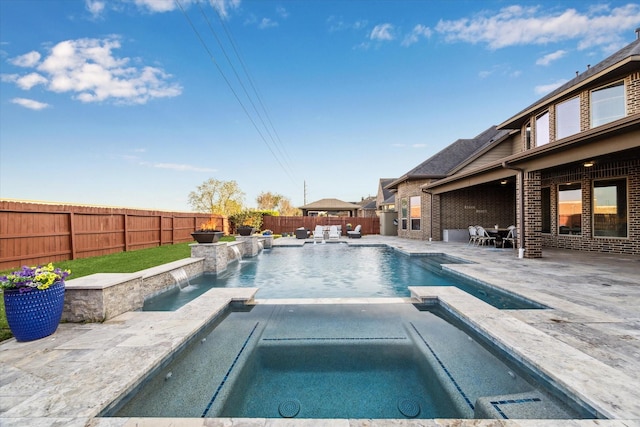 2011 Greenvine Cir, Katy, TX 77494 - view of swimming pool featuring a fenced backyard, a patio, and a pool with connected hot tub