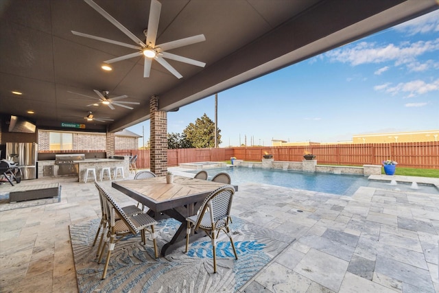 2011 Greenvine Cir, Katy, TX 77494 - view of patio featuring an outdoor kitchen, a fenced backyard, a ceiling fan, and outdoor dining area